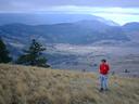Thumbnail of: 30 alex in front of a view of the observatory.jpg