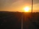 Thumbnail of: Sun setting over dike access road