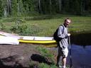 Thumbnail of: Alex inspects a canoe at Wye Lake