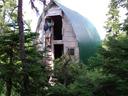 Thumbnail of: Alex climbing down from Meadow Cabin