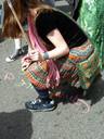 Thumbnail of: Girl peacechalking on the road while marching