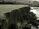 Thumbnail of: Sand ridge carved out by a stream on the beach