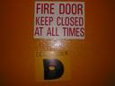Thumbnail of: Signs on door to the wing where all brusherss stay