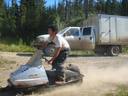 Thumbnail of: Nick rides on the snow-mobile